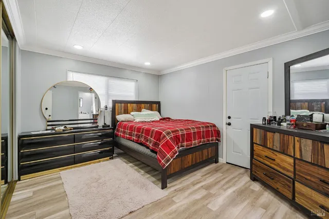 a bedroom with a bed and a closet