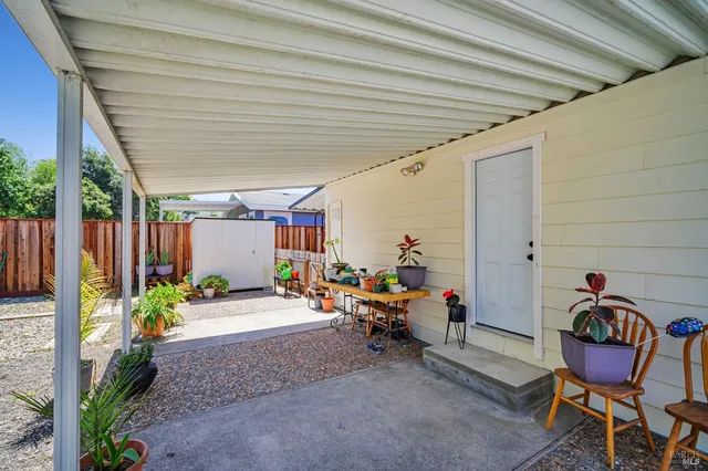 a backyard of a house with green landscape