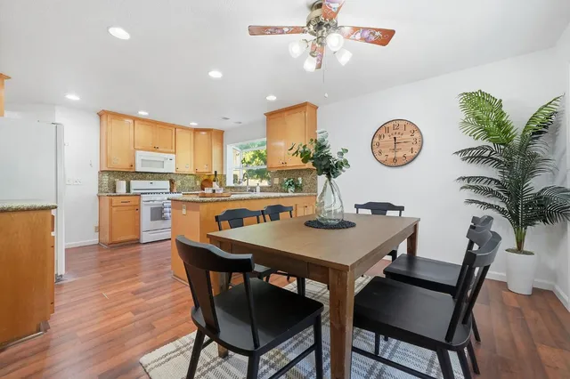 a view of a dining room and a table and chairs