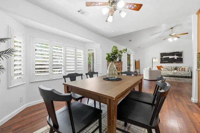 a view of a dining room with furniture window and wooden floor