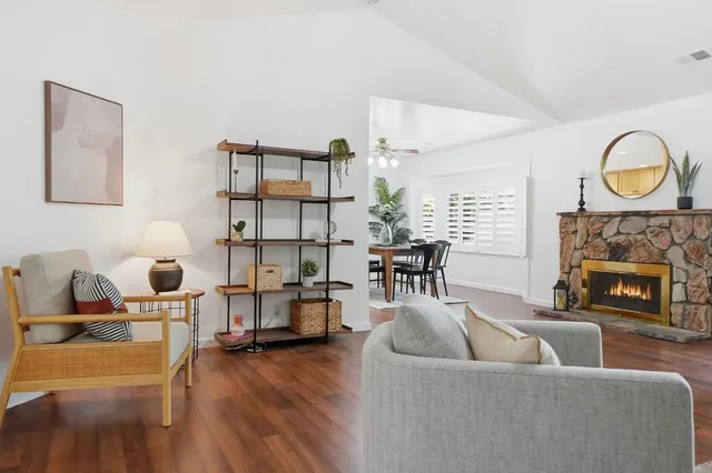 a living room with furniture and a fireplace