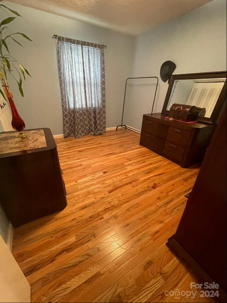 313 Summers Road Morganton, NC 28655 - Photo 17 of 36 a bedroom with a bed and a mirror