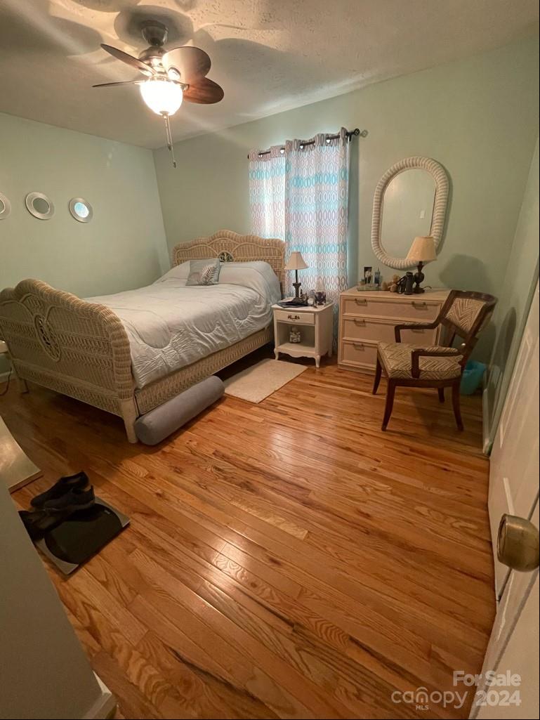 313 Summers Road Morganton, NC 28655 - Photo 19 of 36 a bedroom with a bed window and a chair