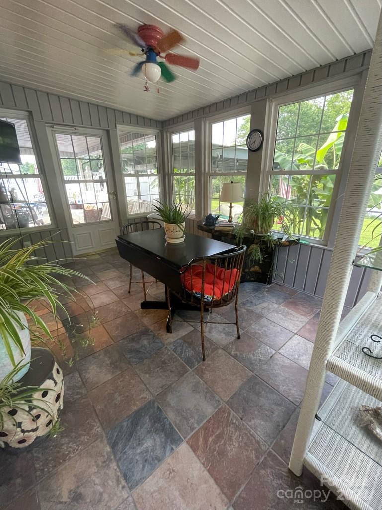 313 Summers Road Morganton, NC 28655 - Photo 24 of 36 a living room with furniture and a floor to ceiling window