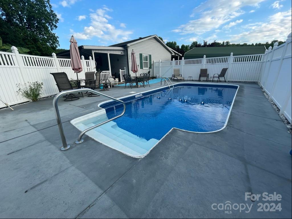 313 Summers Road Morganton, NC 28655 - Photo 30 of 36 a view of a house with pool and chairs