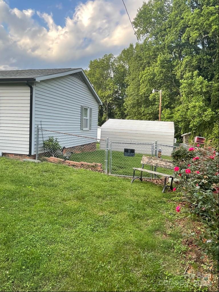 313 Summers Road Morganton, NC 28655 - Photo 6 of 36 a backyard of a house with table and chairs