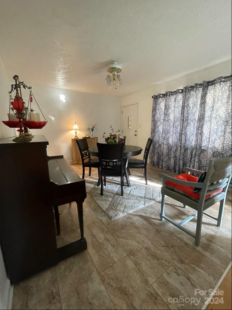 313 Summers Road Morganton, NC 28655 - Photo 10 of 36 a living room with furniture a window and a table