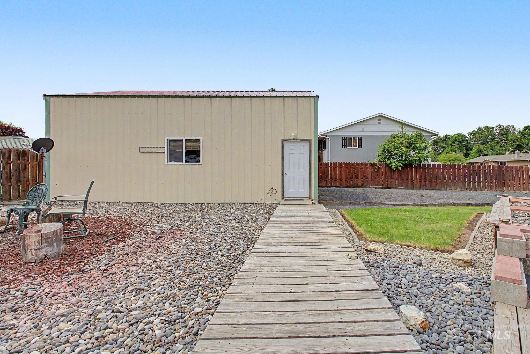 3314 6th Street Lewiston, ID 83501 - Photo 42 of 50 Detached corrugated metal building with a white entry door and single window
