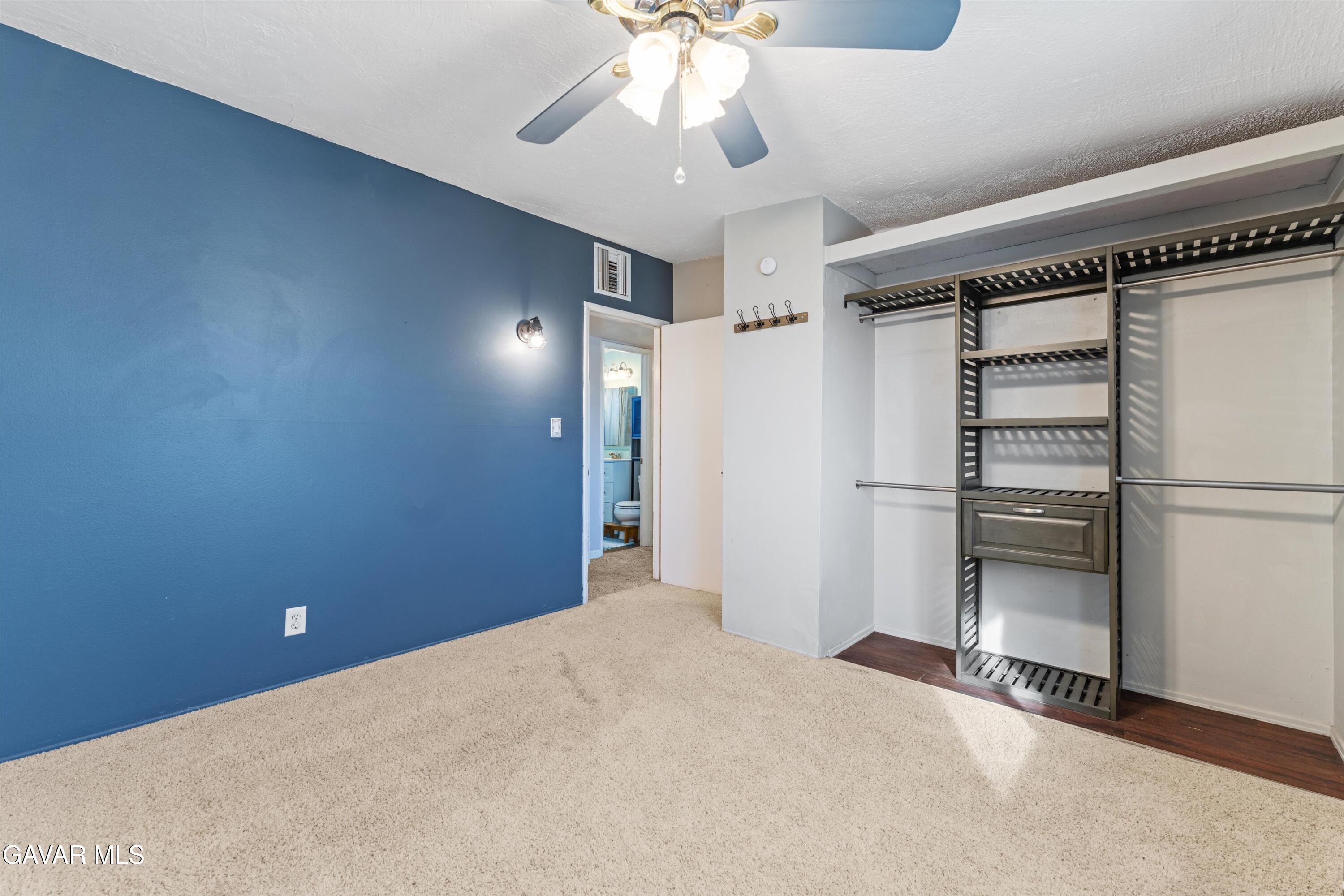 13445 Fran Street North Edwards, CA 93523 - Photo 17 of 27 a view of an empty room with a ceiling fan
