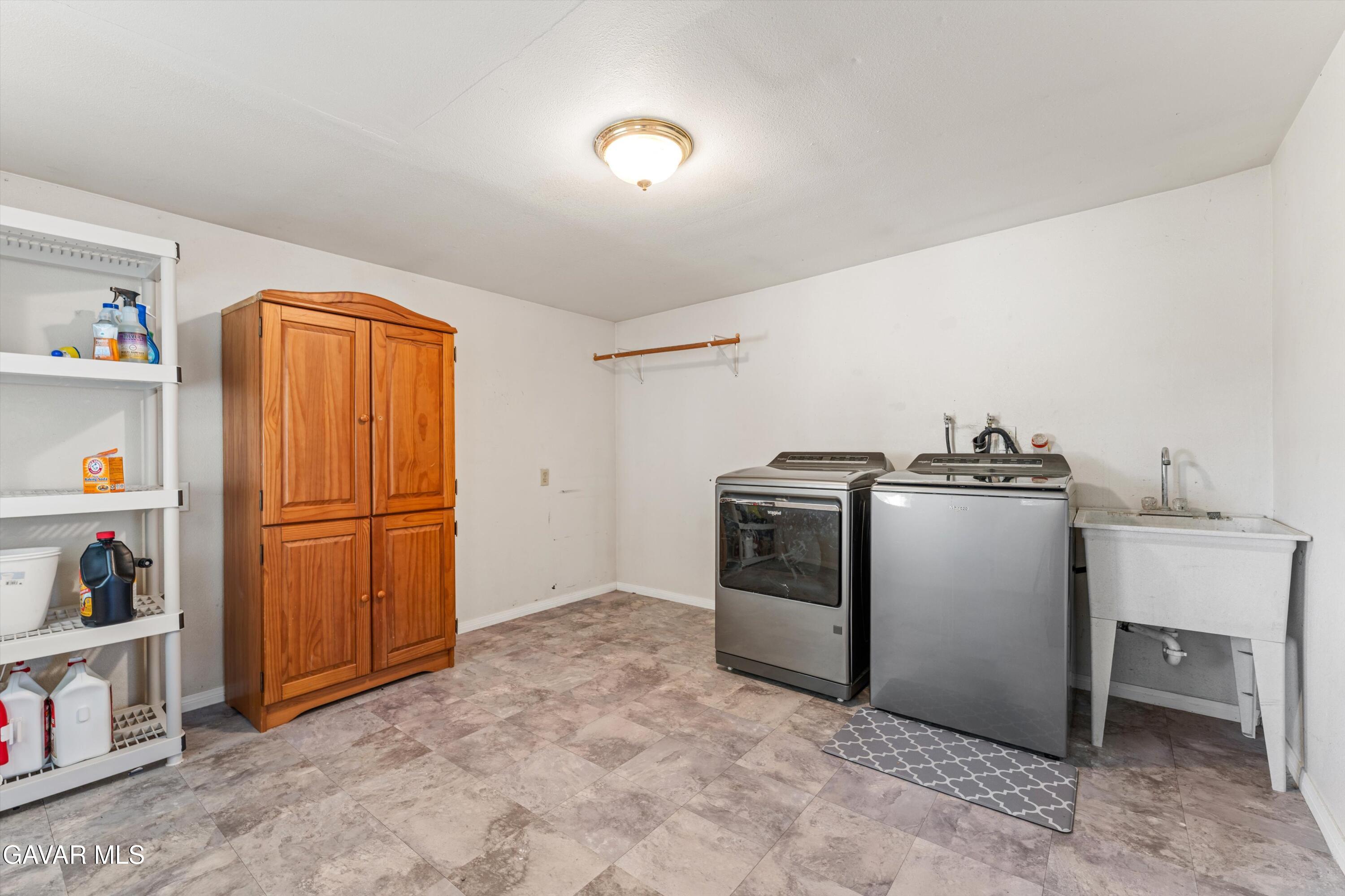 13445 Fran Street North Edwards, CA 93523 - Photo 9 of 27 a utility room with closet dryer and washer