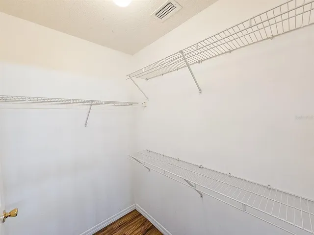 a view of a room with racks on the wall