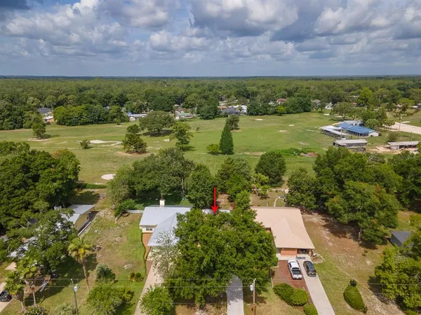 an aerial view of residential building and lake