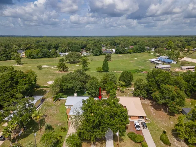 an aerial view of residential building and lake