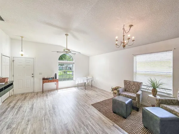 a living room with furniture or window and wooden floor