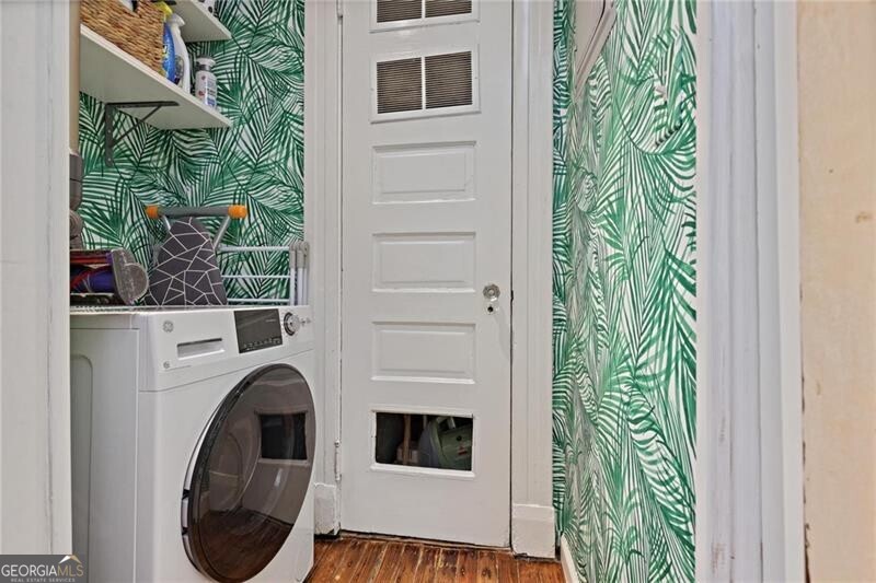 734 Highland Avenue Northeast, Unit 2 Atlanta, GA 30312 - Photo 18 of 24 Laundry area featuring washer / clothes dryer and wood finished floors