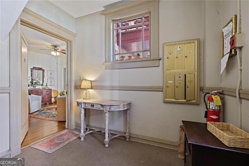 734 Highland Avenue Northeast, Unit 2 Atlanta, GA 30312 - Photo 4 of 24 Hallway featuring carpet and baseboards