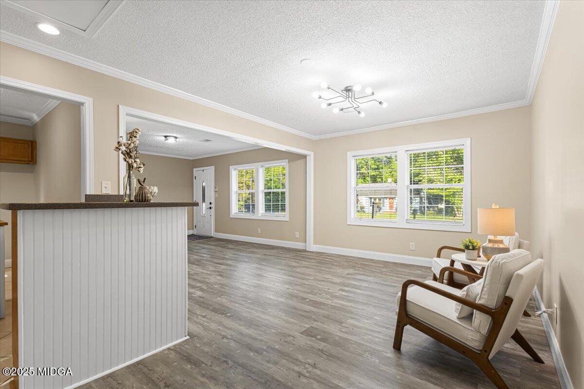 1305 Davis Avenue Perry, GA 31069 - Photo 11 of 26 a living room with furniture and a large window