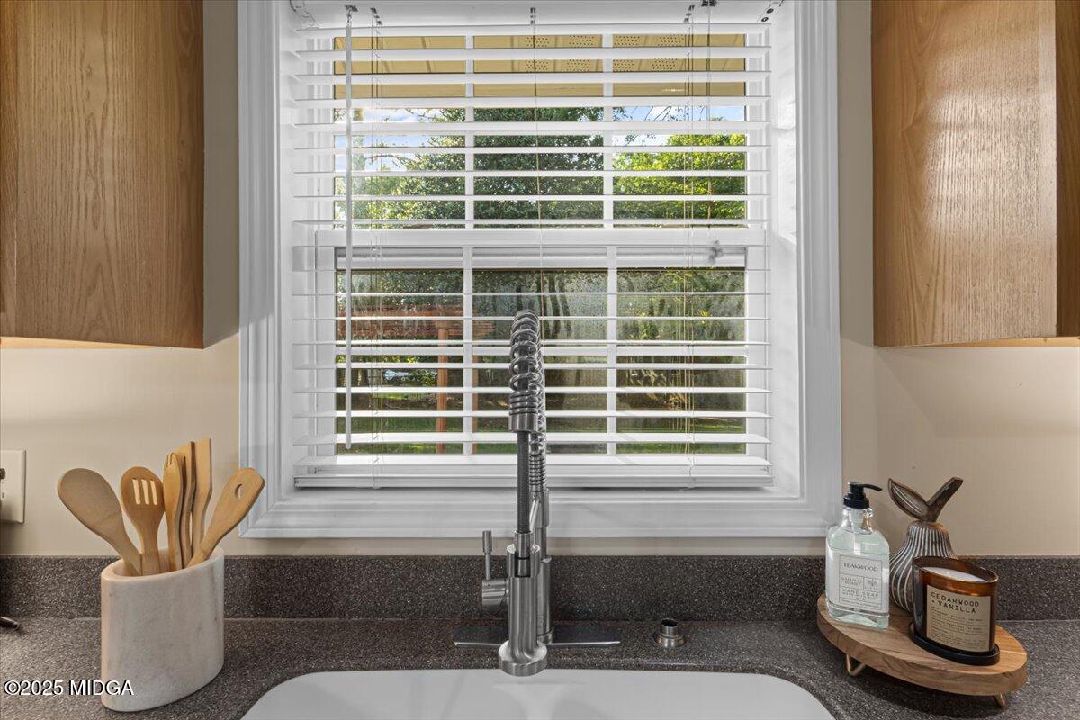 1305 Davis Avenue Perry, GA 31069 - Photo 15 of 26 a bathroom with a sink and a window
