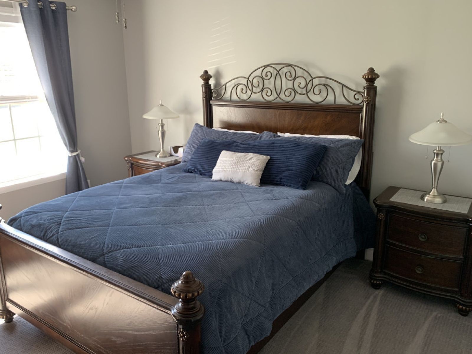 59 Falcon Drive Manchester, TN 37355 - Photo 15 of 20 a bed sitting in a bedroom next to a window