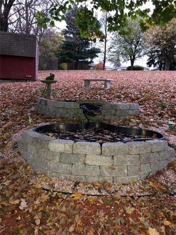 96 Crestvue Road Washington, PA 15301 - Photo 22 of 25 Two Level Pond with intricate water flow system; flog spouts into upper pond, which flows into lower pond. Bench to sit and enjoy the nature setting. Also, entire length of end of yard covered with weed-barrier underneath extensive bed of mulch.