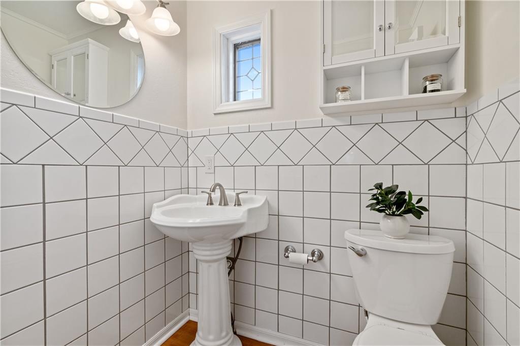4636 Brownsville Road Pittsburgh, PA 15236 - Photo 14 of 40 a bathroom with a sink toilet and a mirror