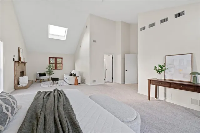 a bedroom with furniture and a chandelier