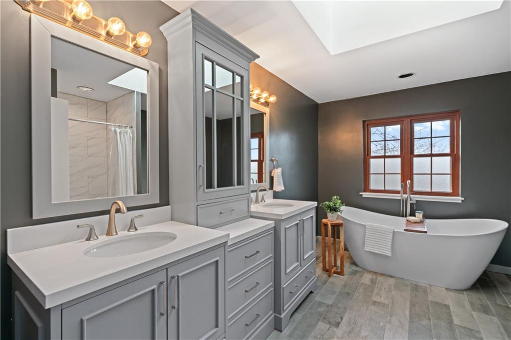 4636 Brownsville Road Pittsburgh, PA 15236 - Photo 18 of 40 a spacious bathroom with a double vanity sink mirror and double