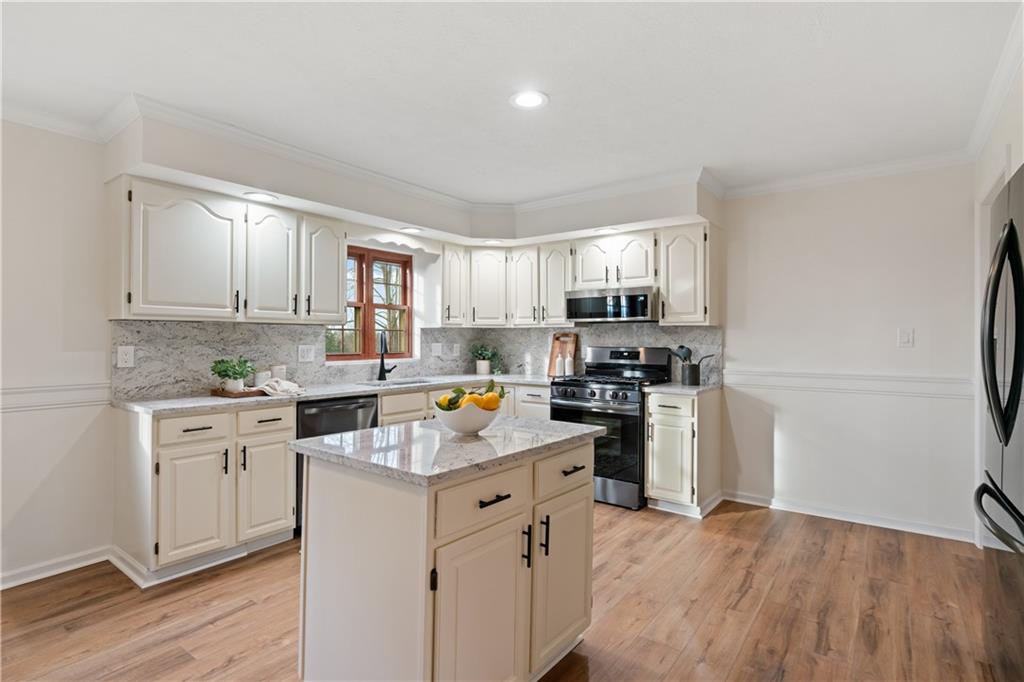4636 Brownsville Road Pittsburgh, PA 15236 - Photo 8 of 40 a kitchen with a refrigerator stove top oven and sink