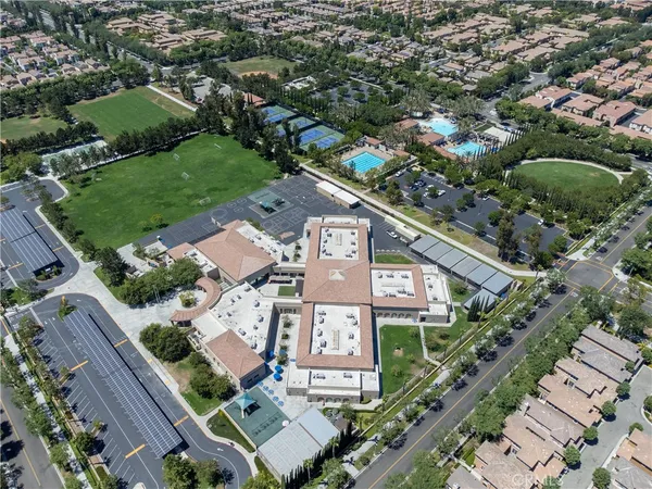 an aerial view of residential houses with outdoor space