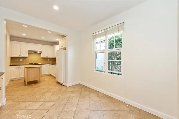 a view of kitchen with furniture and window