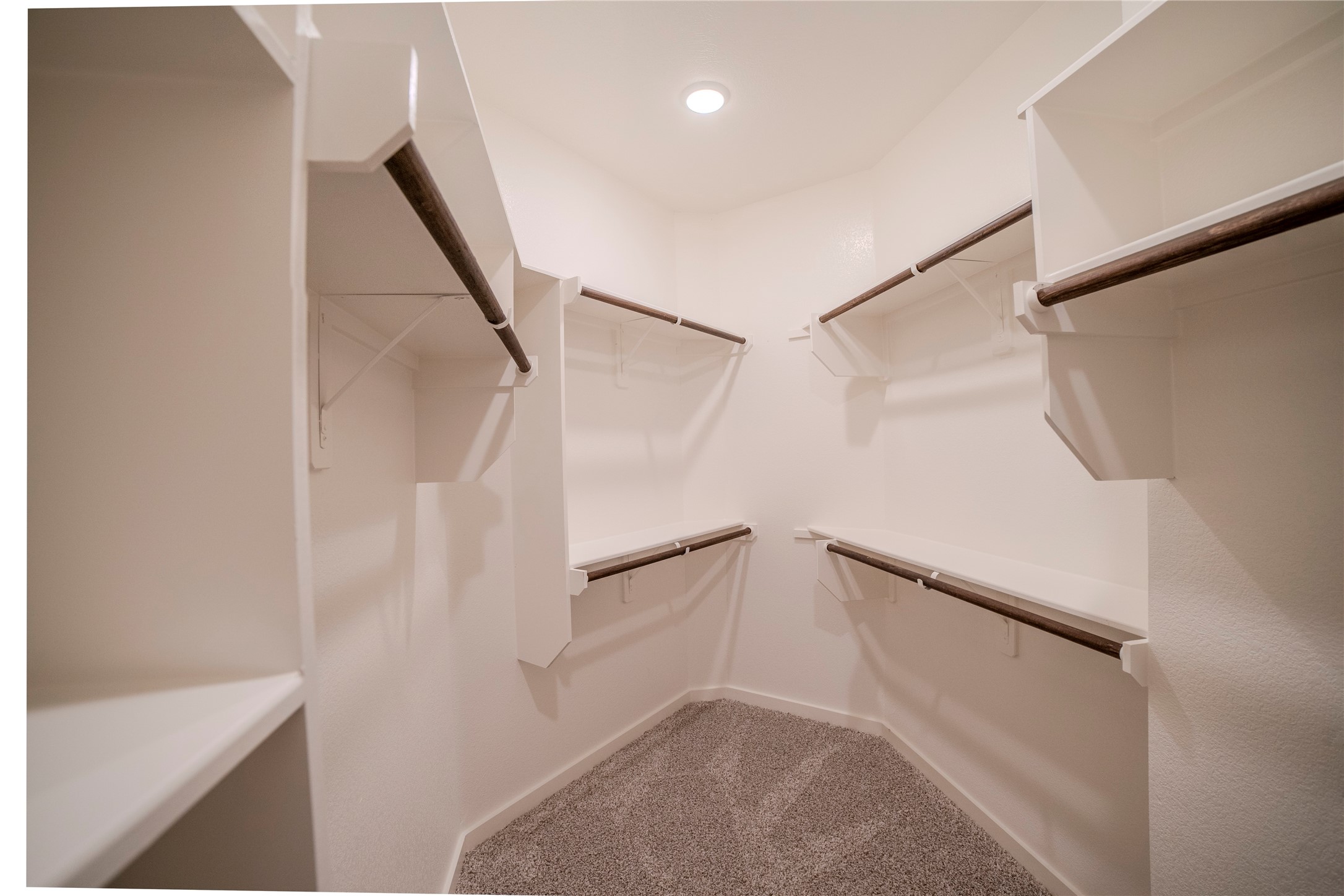 1402 Lk Rdg Drive Brenham, TX 77833 - Photo 33 of 35 a view of walk in closet with empty racks