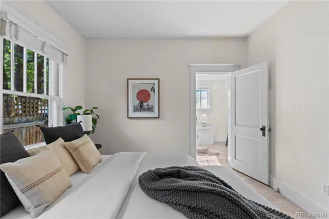 a bedroom with a bed and a couch