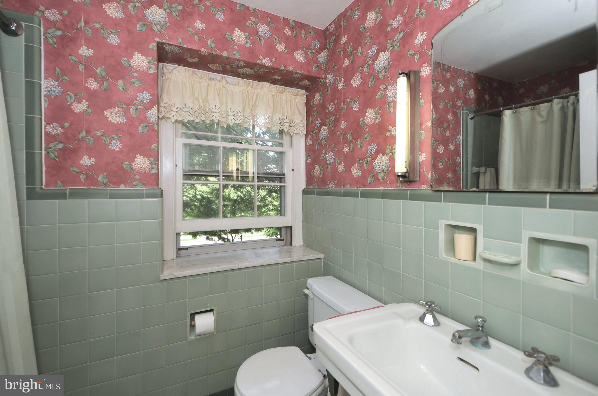120 Hewett Road Wyncote, PA 19095 - Photo 19 of 44 a bathroom with a sink mirror and toilet
