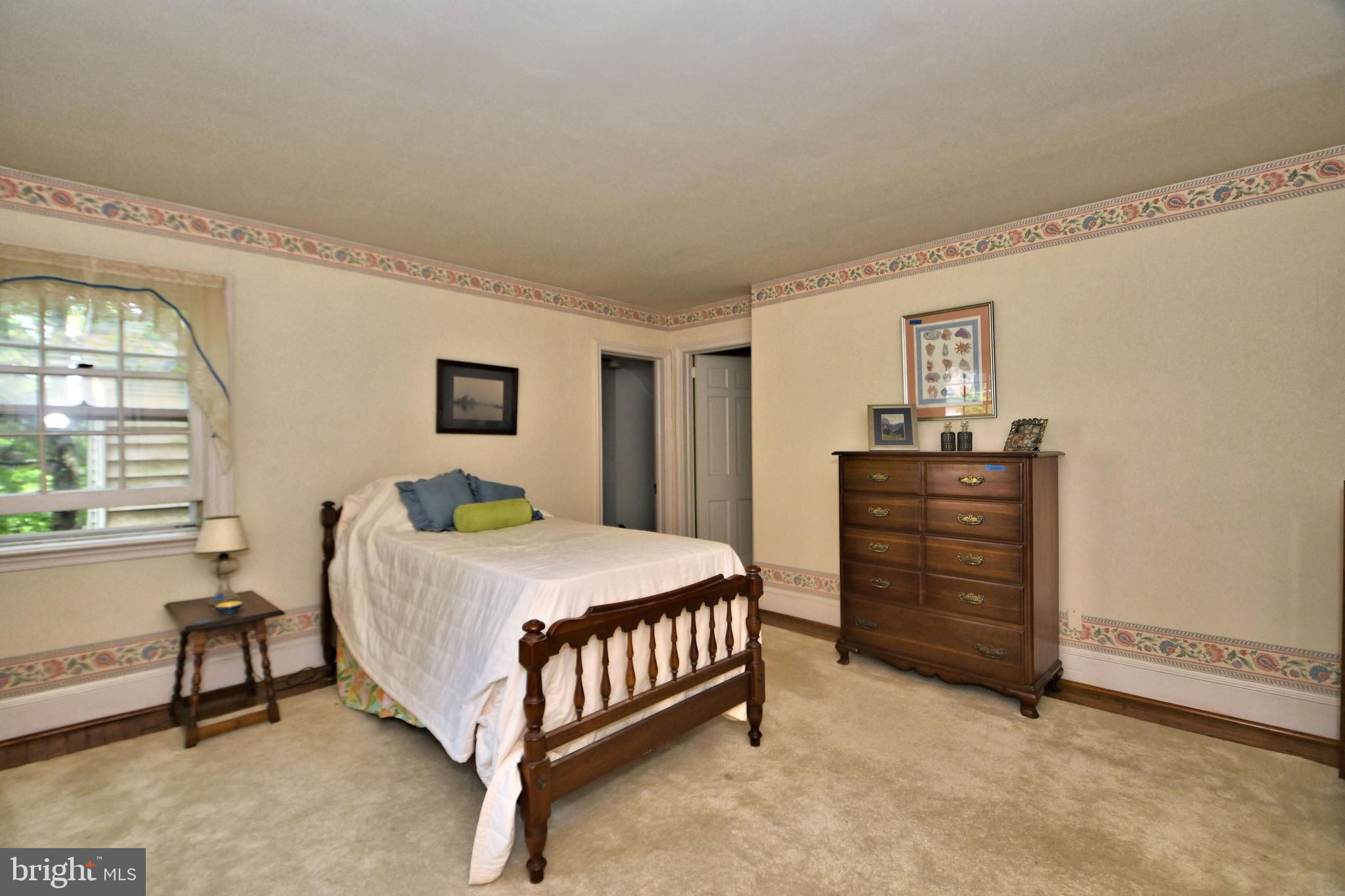 120 Hewett Road Wyncote, PA 19095 - Photo 20 of 44 a bedroom with a bed and a table