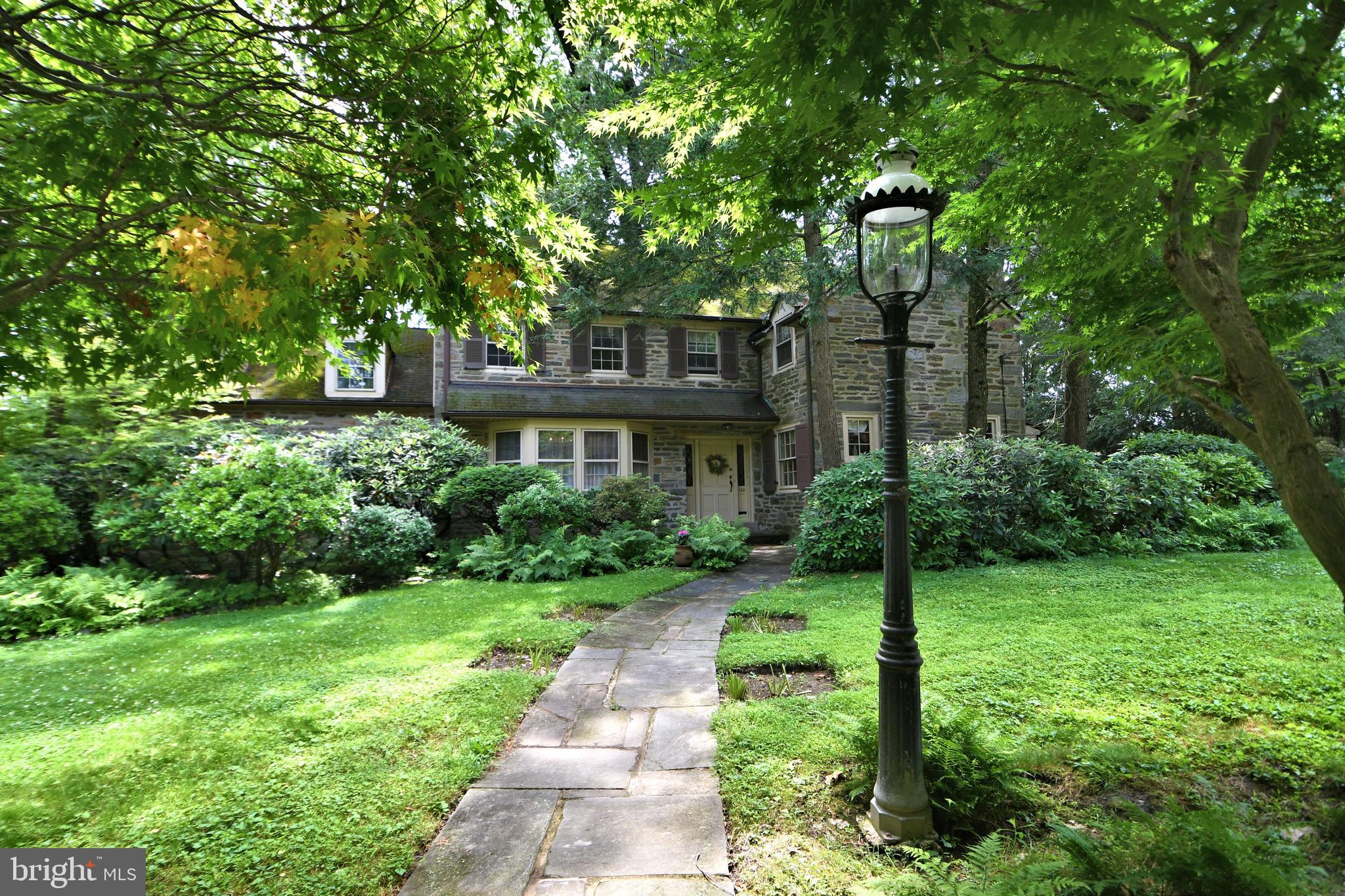 120 Hewett Road Wyncote, PA 19095 - Photo 3 of 44 a front view of a house with garden