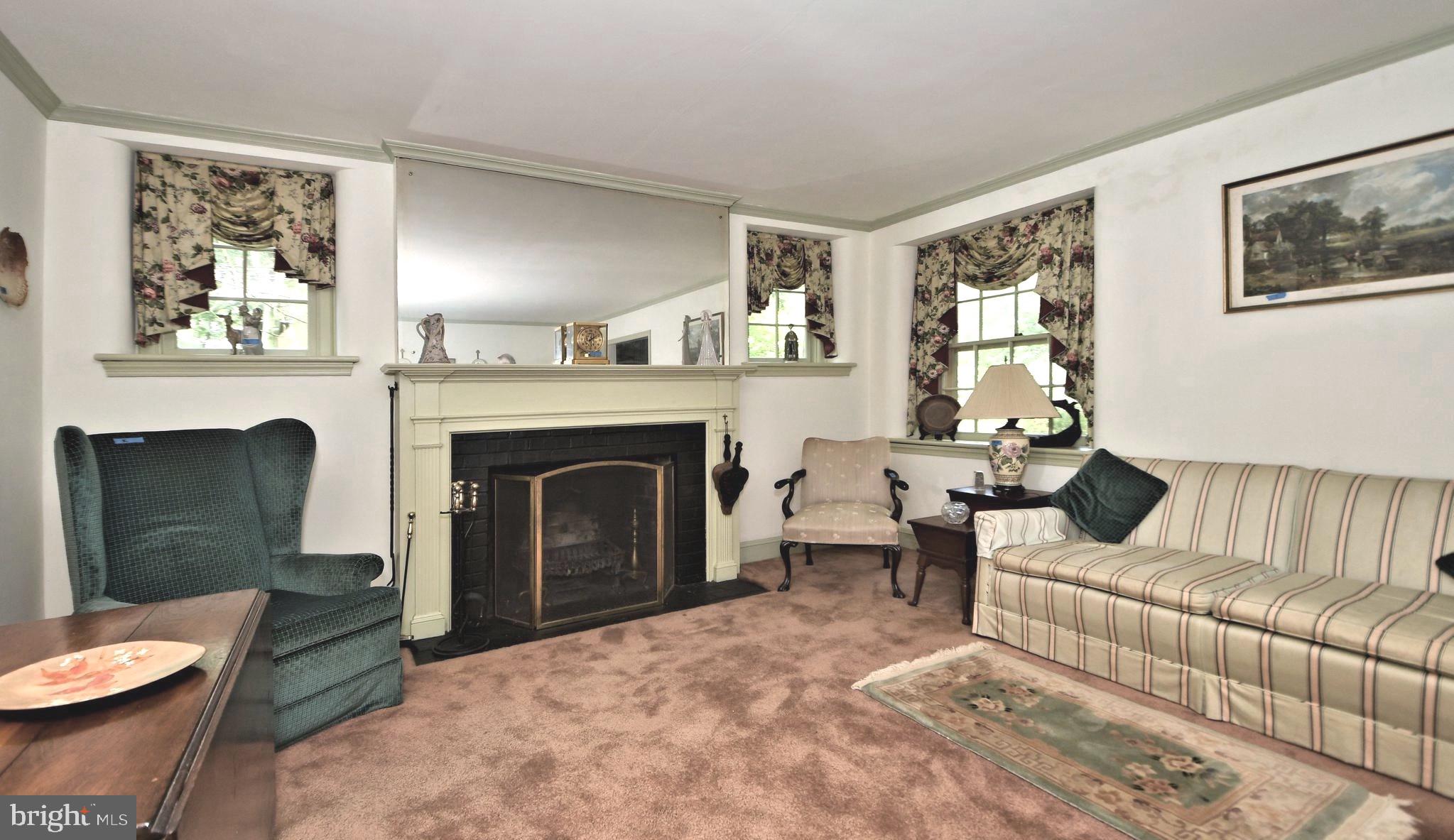 120 Hewett Road Wyncote, PA 19095 - Photo 4 of 44 a living room with furniture and a fireplace