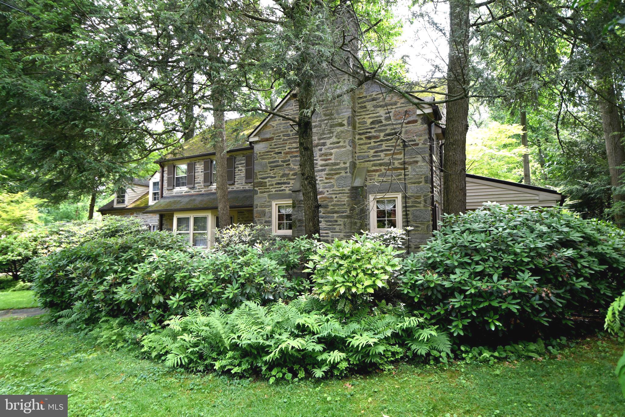 120 Hewett Road Wyncote, PA 19095 - Photo 34 of 44 front view of a house with a tree
