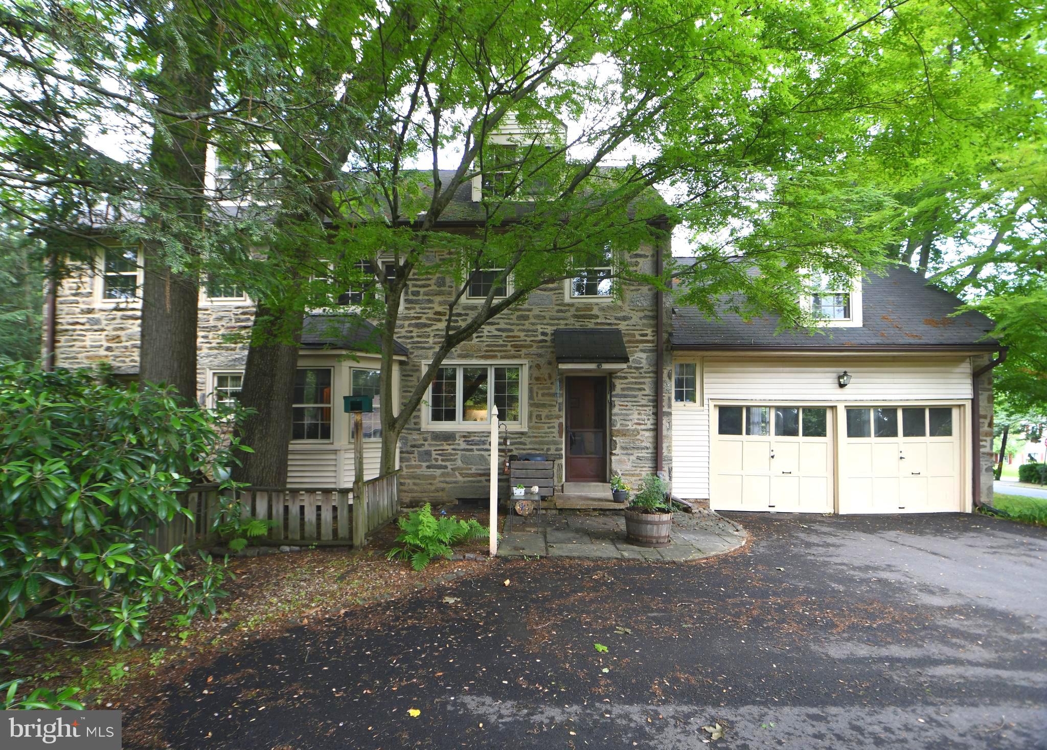 120 Hewett Road Wyncote, PA 19095 - Photo 39 of 44 a front view of a house with a yard and potted plants