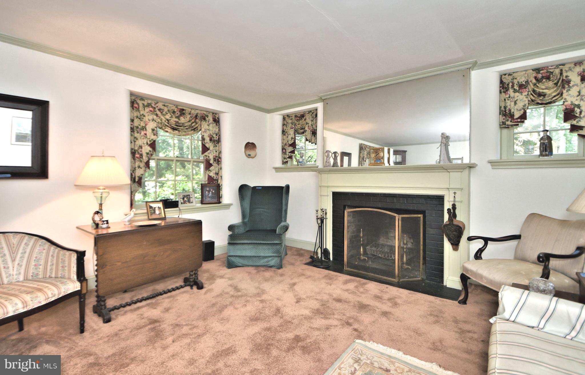 120 Hewett Road Wyncote, PA 19095 - Photo 5 of 44 a living room with furniture and a fireplace