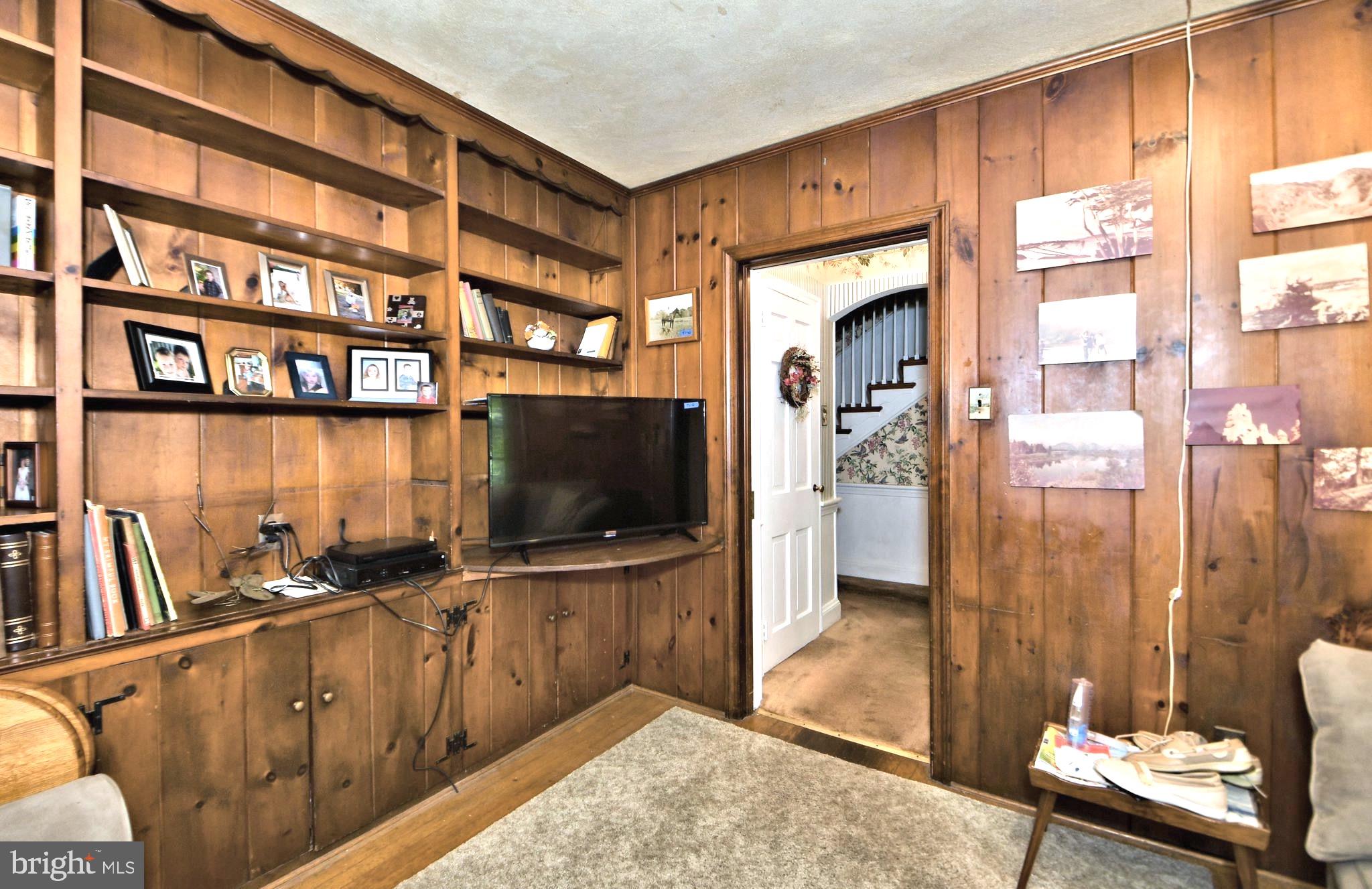 120 Hewett Road Wyncote, PA 19095 - Photo 6 of 44 a living room with furniture and a flat screen tv