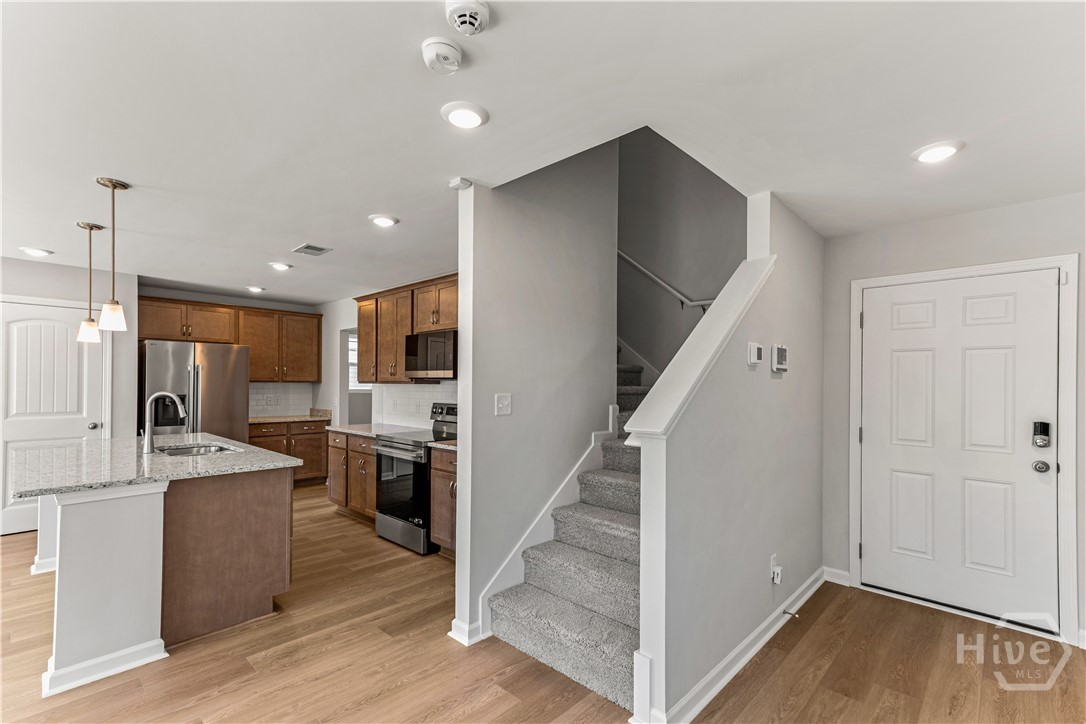 221 Hasty Point Road Rincon, GA 31326 - Photo 8 of 40 Stairs and Kitchen