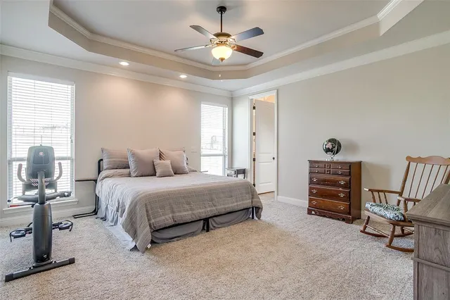 a bedroom with bed and a chandelier