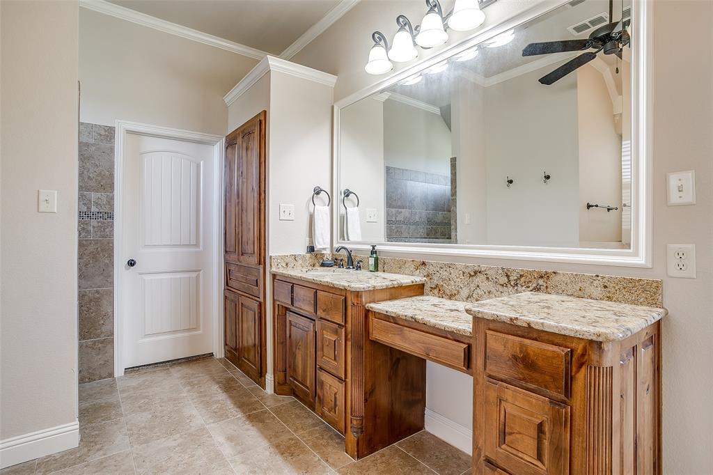 131 Condor View Weatherford, TX 76087 - Photo 14 of 34 a bathroom with a sink double vanity and a mirror