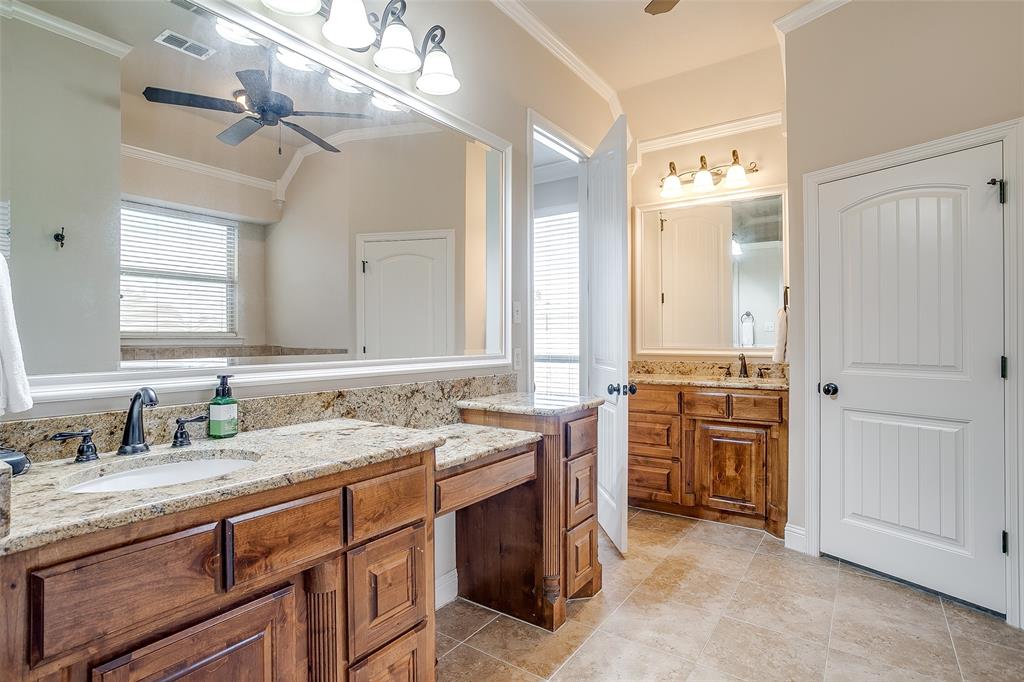 131 Condor View Weatherford, TX 76087 - Photo 15 of 34 a spacious bathroom with a granite countertop double vanity sink a mirror and a shower