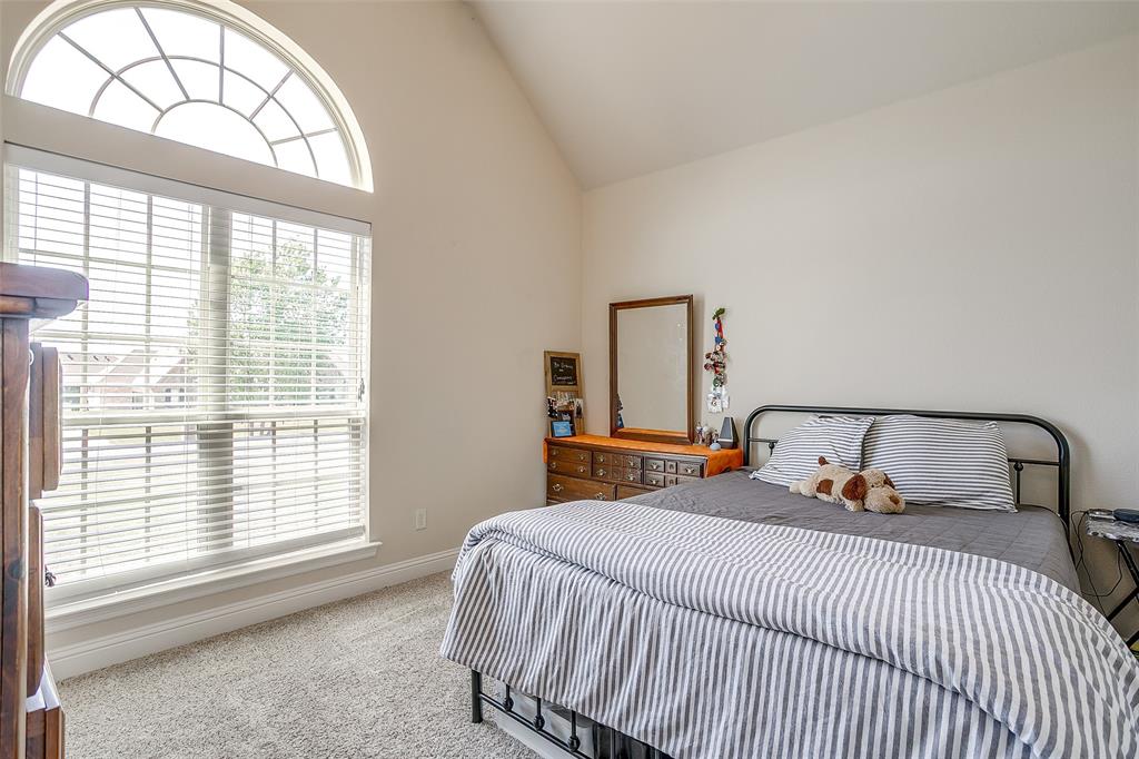 131 Condor View Weatherford, TX 76087 - Photo 16 of 34 a bedroom with a large bed and a large window