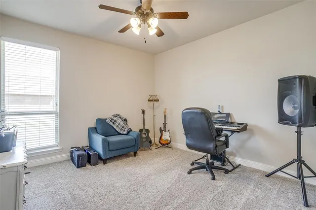 a view of workspace with furniture and windows