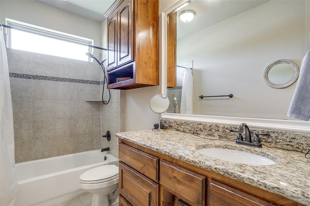 131 Condor View Weatherford, TX 76087 - Photo 18 of 34 a bathroom with a granite countertop sink toilet and shower