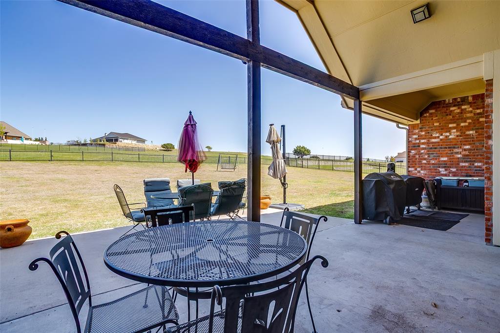 131 Condor View Weatherford, TX 76087 - Photo 24 of 34 a view of a swimming pool with an outdoor seating