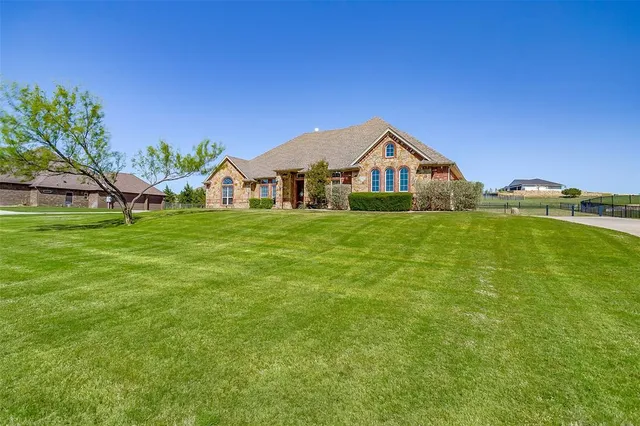 a house with garden in front of it