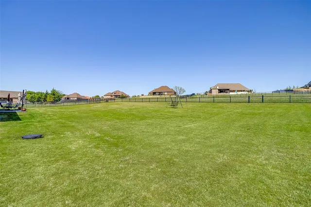 a view of a golf course with a lake